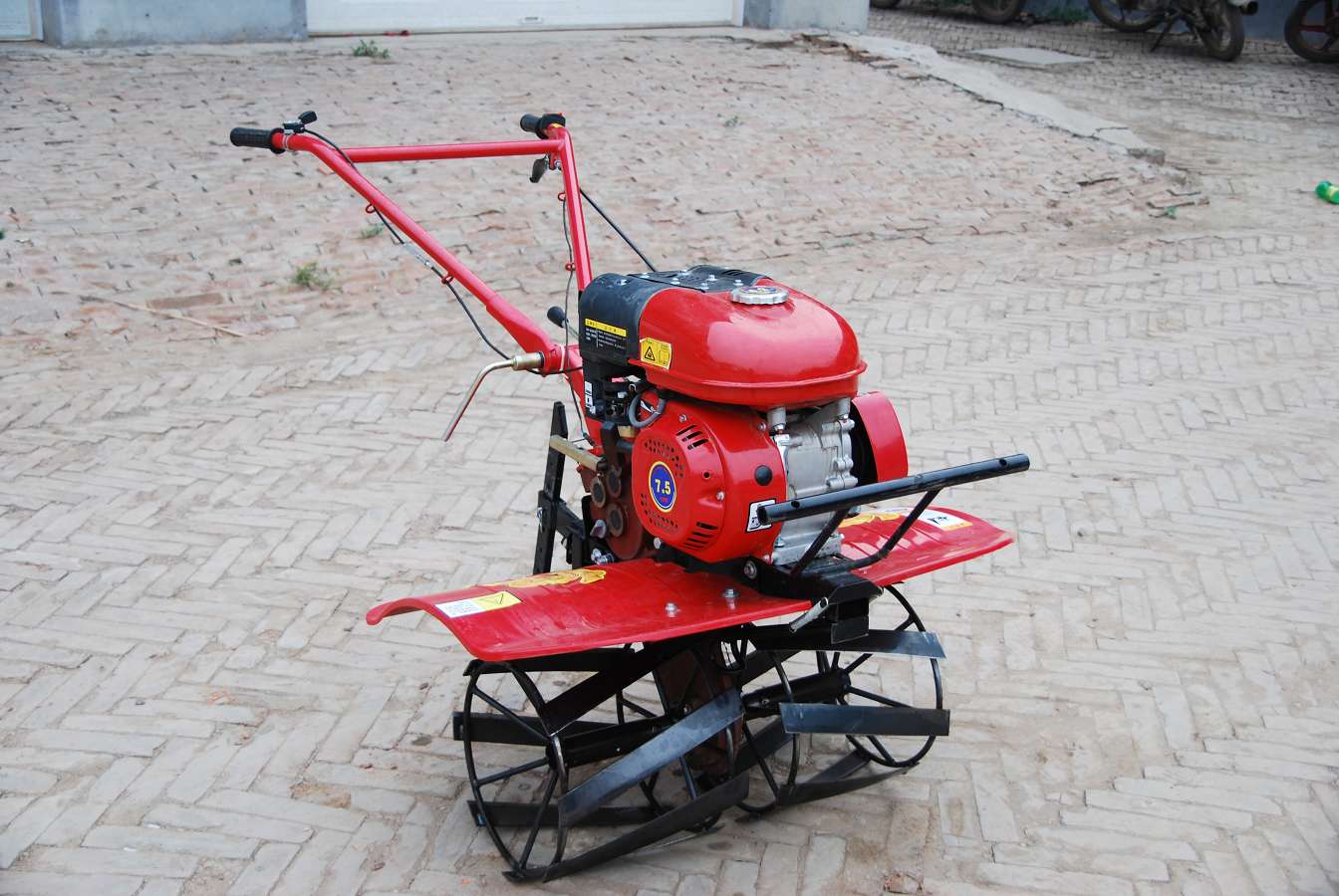 mini tiller with weeding wheels.JPG